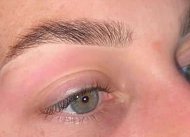 Close-up of expertly shaped eyebrow from Glow it in Limenas Chersonisou, GR showcasing beauty care.