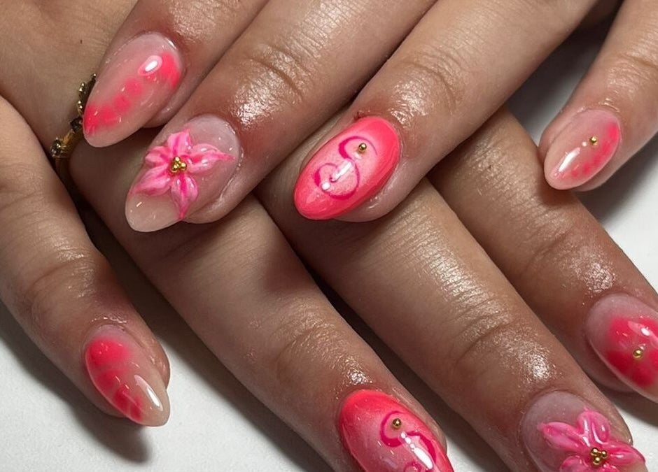 Intricate pink floral nail art from Glow it in Limenas Chersonisou, GR showcasing creative beauty designs.