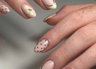 Elegant nail art featuring polka dots and florals at Salon 17, Tamworth, England, GB.