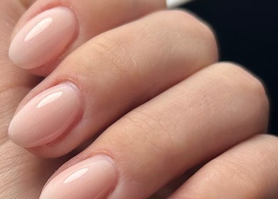 Elegant manicured nails at Nails By Tilly Louise, Chichester, England, GB showcasing glossy nude finish.