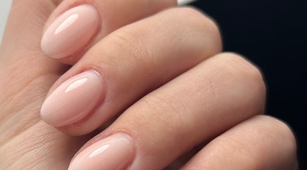 Elegant manicured nails at Nails By Tilly Louise, Chichester, England, GB showcasing glossy nude finish.