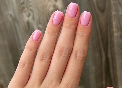 Elegant pink manicure at Nails By Tilly Louise, Chichester, England, GB, highlighting pristine nail art.