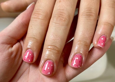 Stylish pink polka dot nails at Nails By Tilly Louise, Chichester, England, GB.