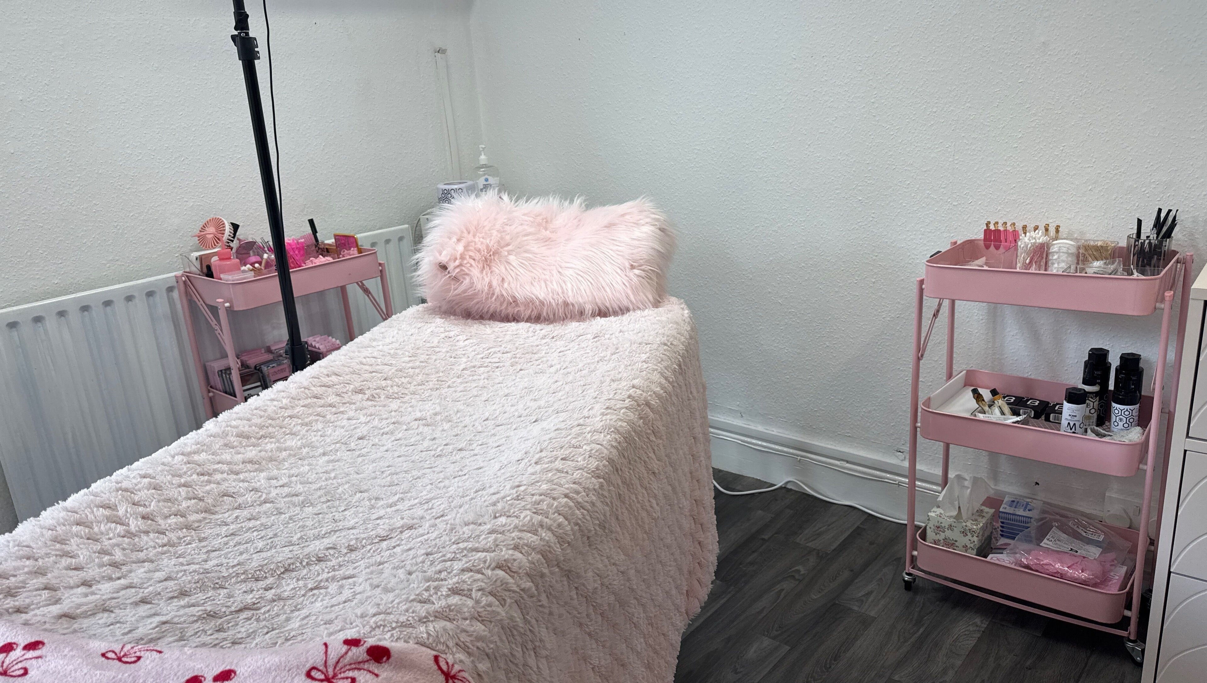 Cozy beauty treatment bed at Mon Cheri by Megan Dermody, Ystalyfera, Wales, GB.
