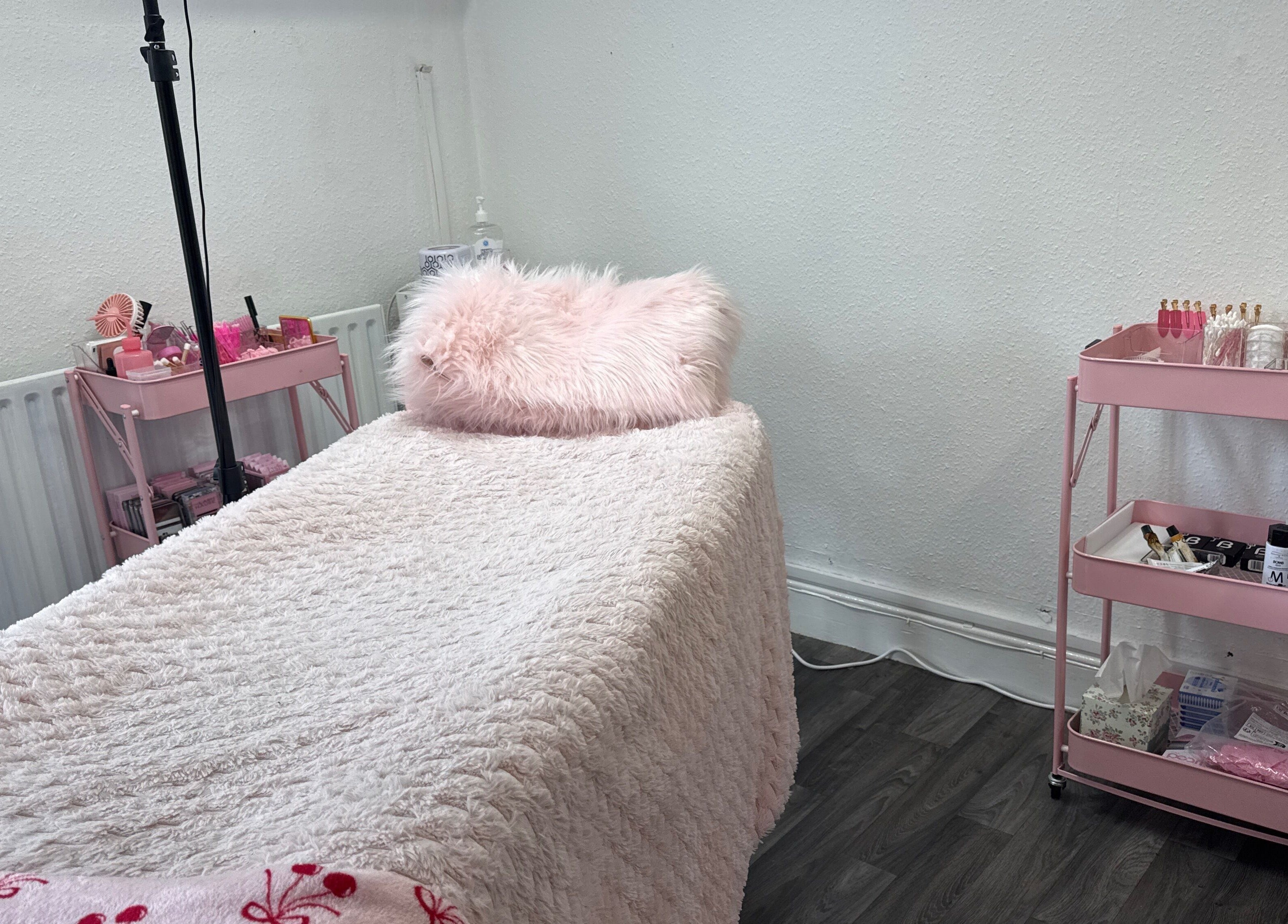Cozy beauty treatment bed at Mon Cheri by Megan Dermody, Ystalyfera, Wales, GB.