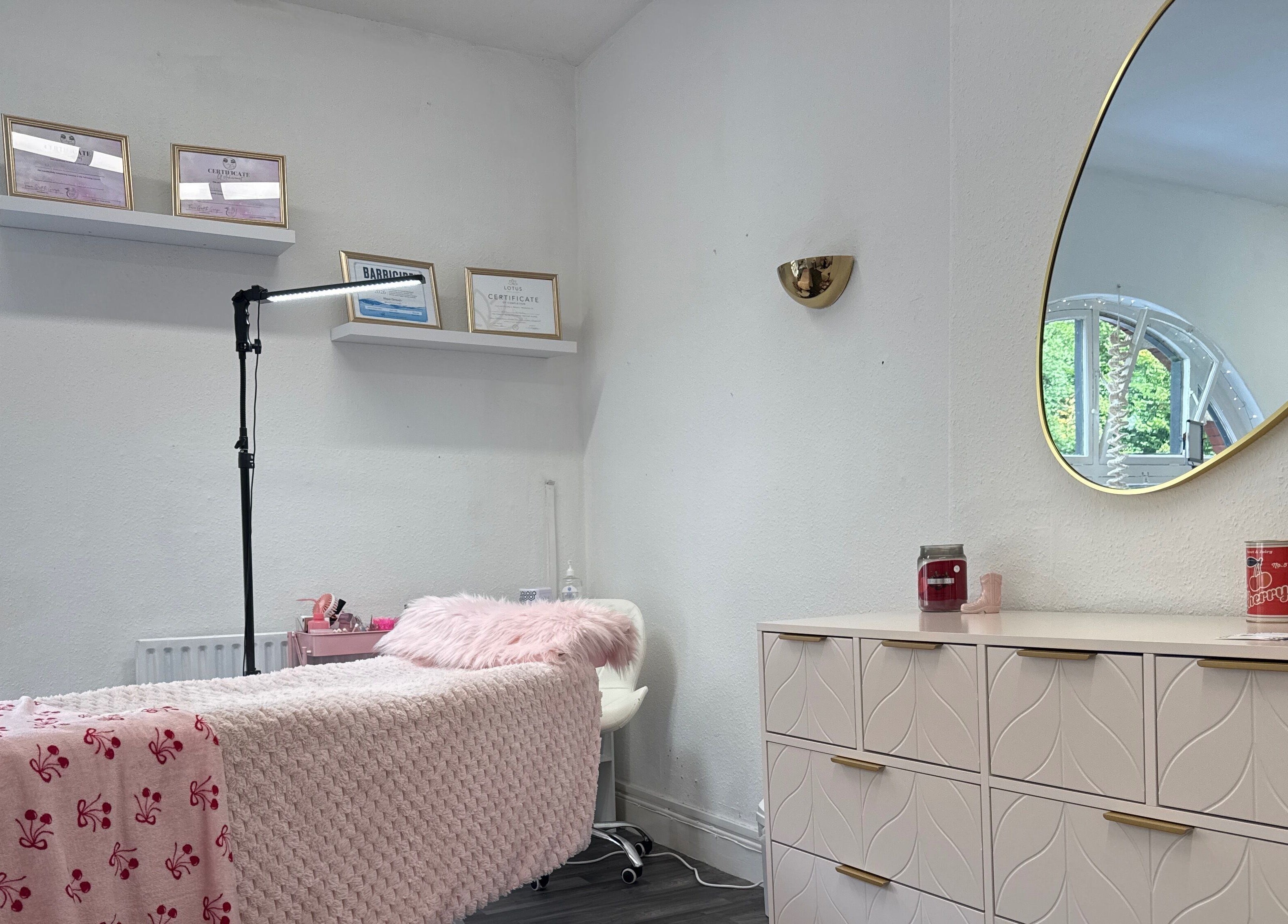 Chic beauty room at Mon Cheri by Megan Dermody in Ystalyfera, Wales, GB with soft decor and elegant mirror.