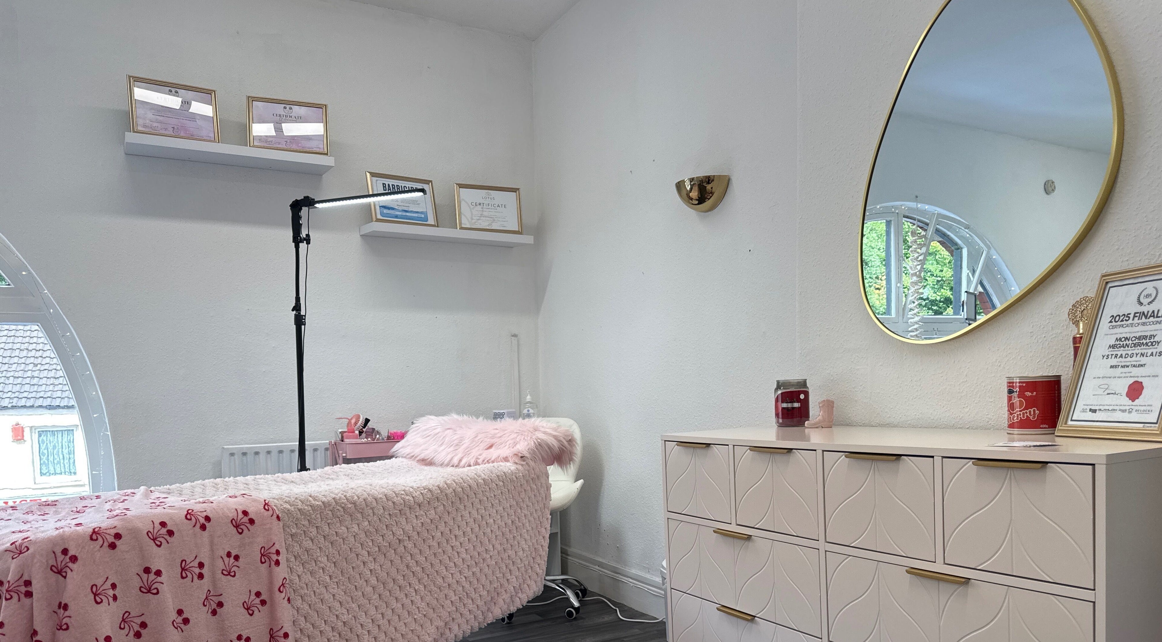 Chic beauty room at Mon Cheri by Megan Dermody in Ystalyfera, Wales, GB with soft decor and elegant mirror.