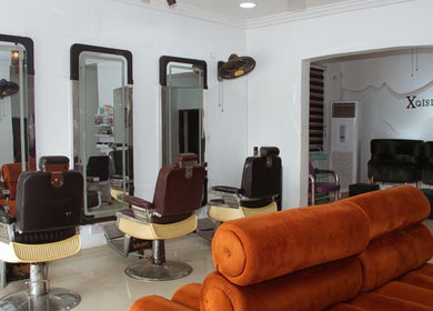 Modern salon seating and styling stations at Xqisite Medspa & Salon, Benin City, Edo, NG.