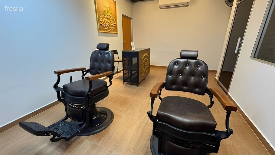 Elegant barber chairs at Kedai Gunting Rambut Cameo, Tanjong Malim, Selangor, MY capture cozy ambiance.