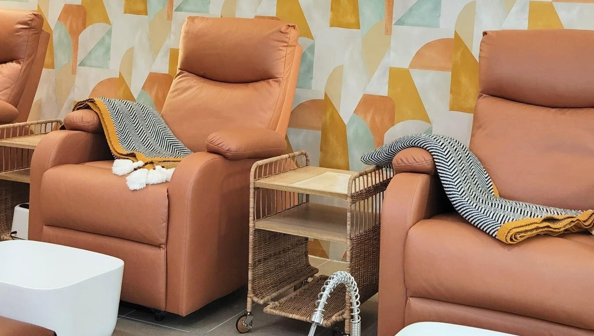 Relax in plush chairs at SugaNails KL, Ampang, Selangor, MY for a luxurious nail experience.