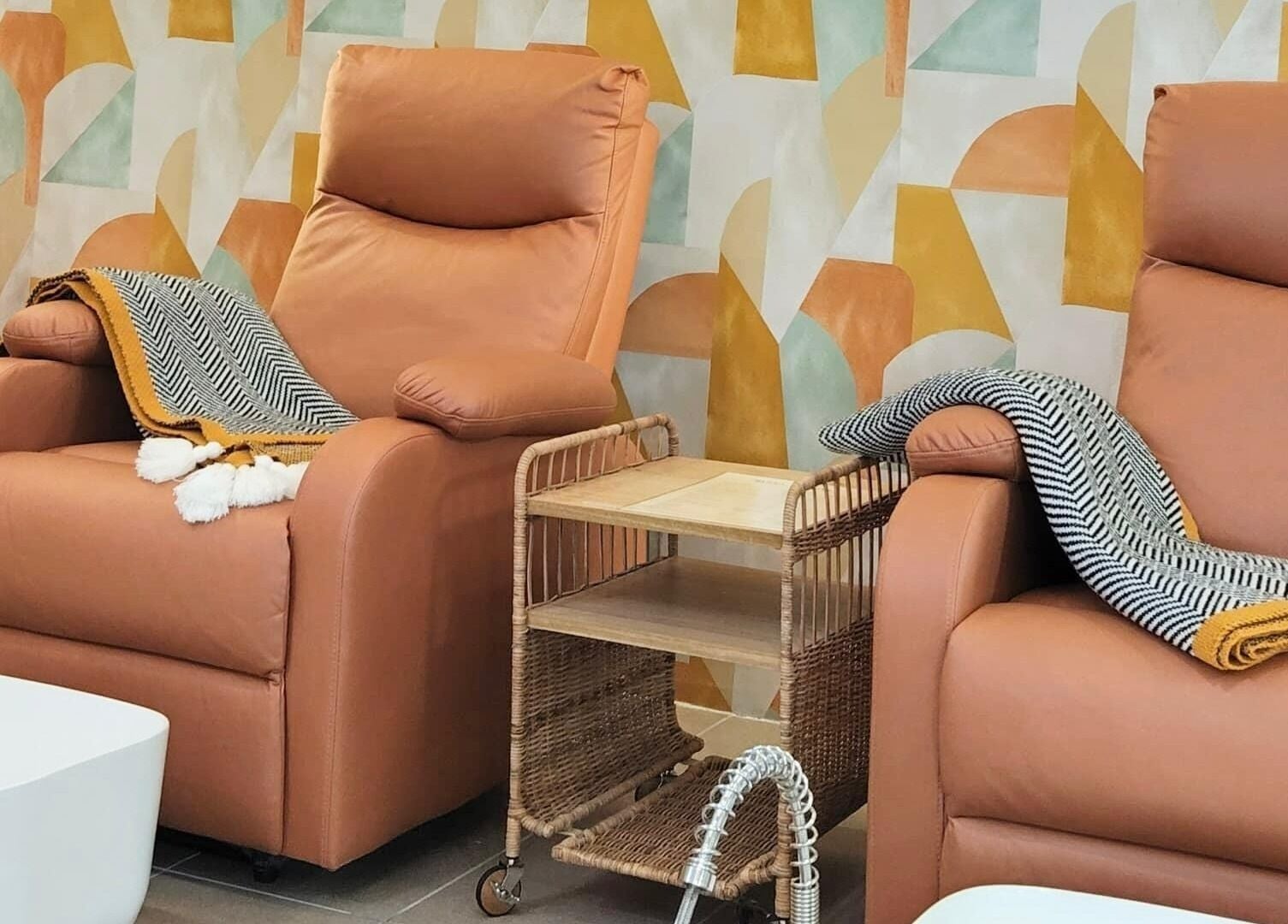 Relax in plush chairs at SugaNails KL, Ampang, Selangor, MY for a luxurious nail experience.