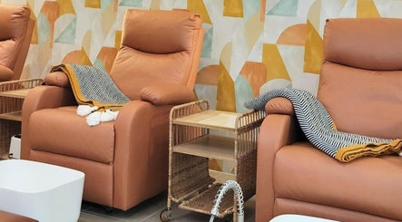 Relax in plush chairs at SugaNails KL, Ampang, Selangor, MY for a luxurious nail experience.