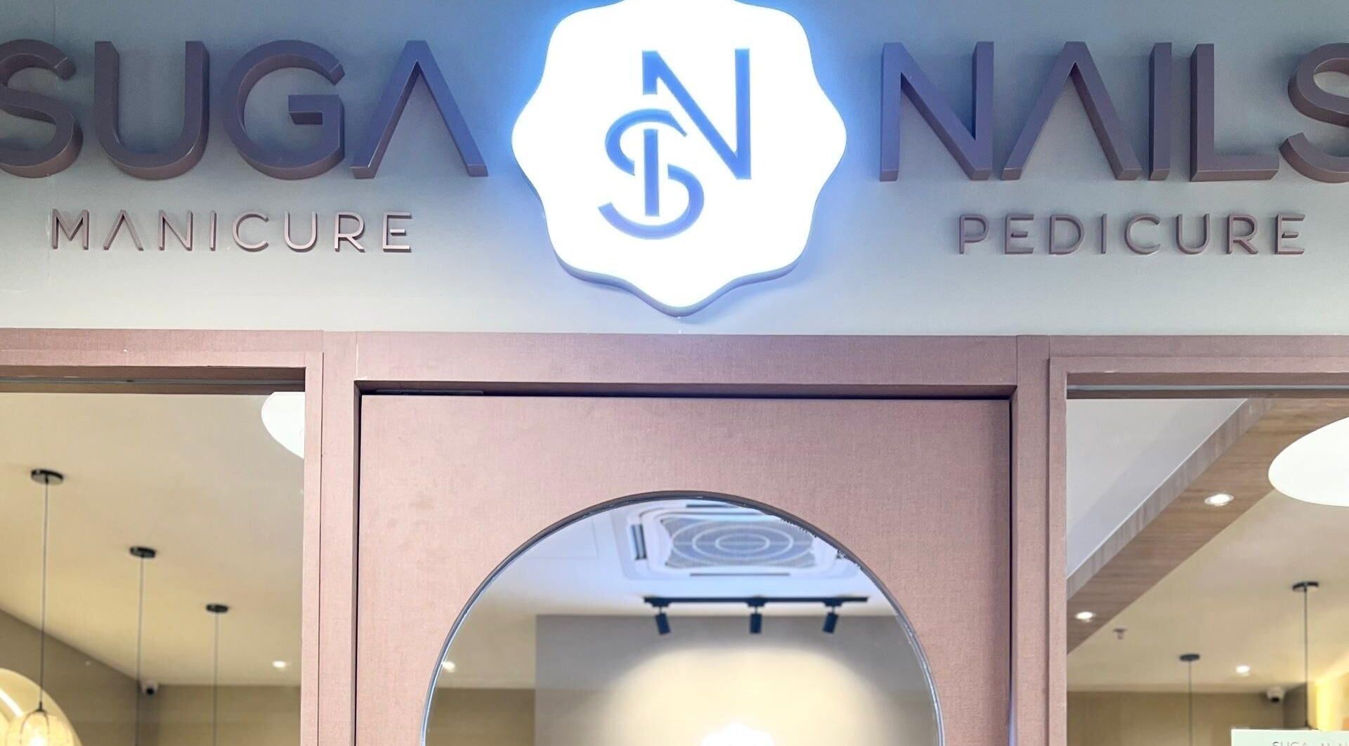 Entrance of SugaNails KL, a stylish salon in Ampang, Selangor, MY offering manicure and pedicure services.