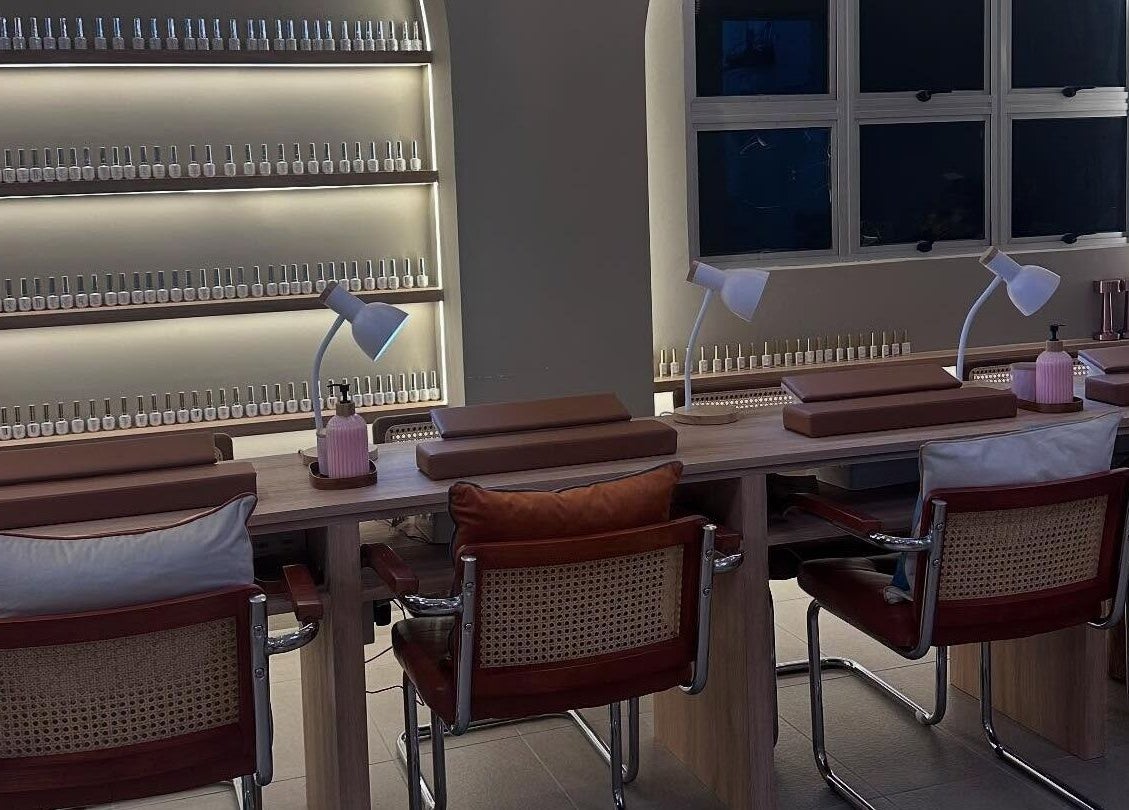 Cozy nail salon station at SugaNails KL, Ampang, Selangor, MY with stylish chairs and ample polish selection.