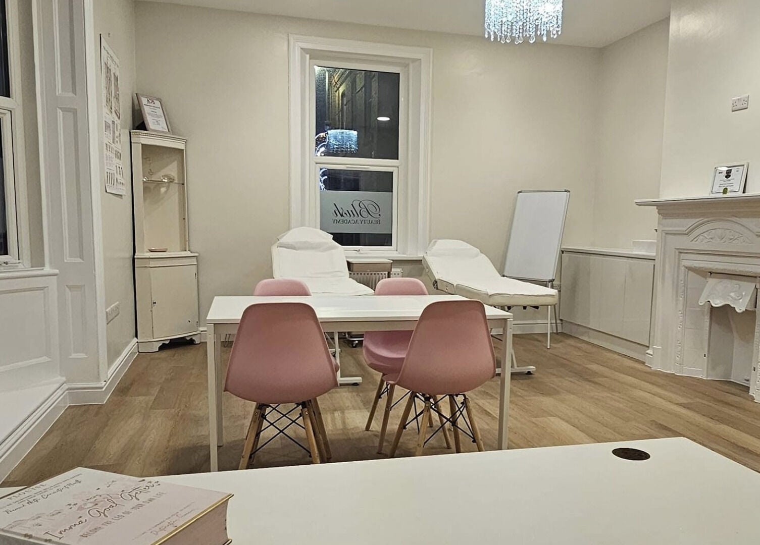 Blush beauty space with white chairs and pink accents, Blyth, England, GB.