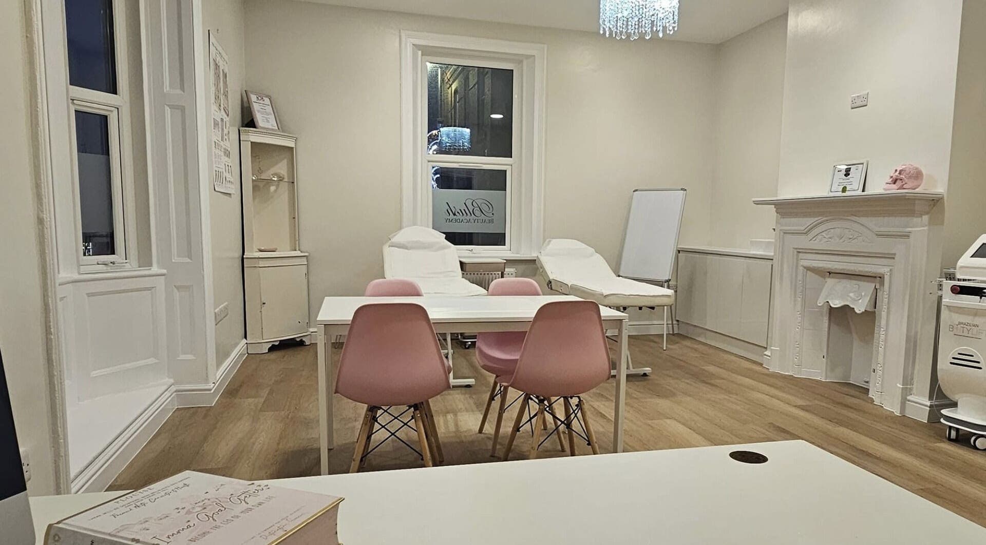 Blush beauty space with white chairs and pink accents, Blyth, England, GB.