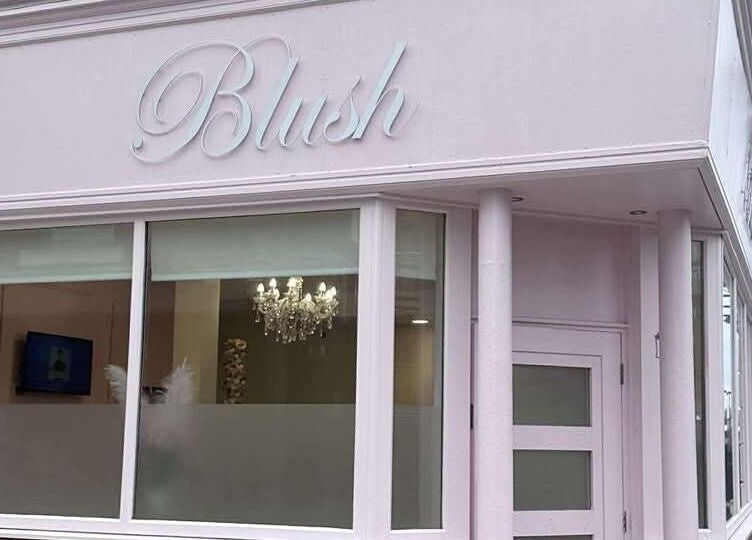 Chic pink exterior of Blush beauty venue, Blyth, England, GB with elegant signage.