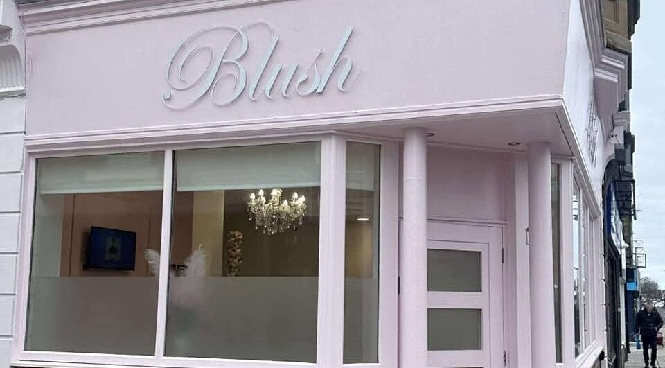 Chic pink exterior of Blush beauty venue, Blyth, England, GB with elegant signage.
