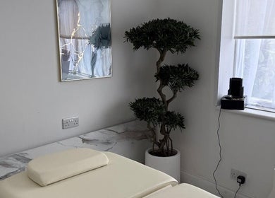 Relaxation room at Clinic 103 with a massage table and decor in Harpenden, England, GB.