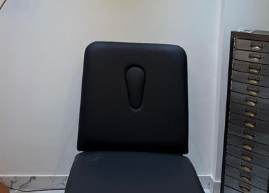Modern treatment chair at Clinic 103 in Harpenden, England, GB accentuated by sleek furnishings.