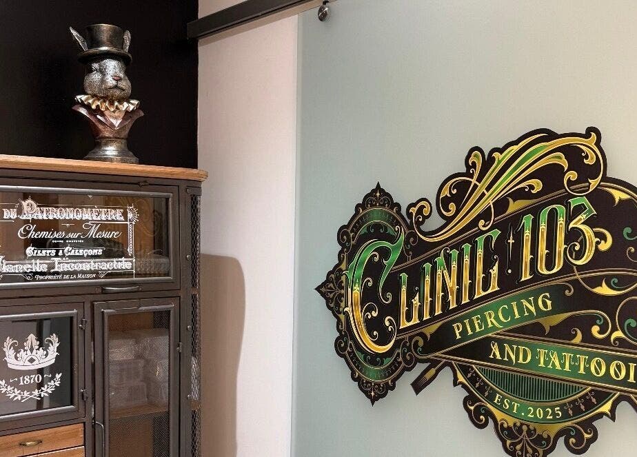 Entrance of Clinic 103 in Harpenden, England, showcasing a vintage decor and detailed sign.