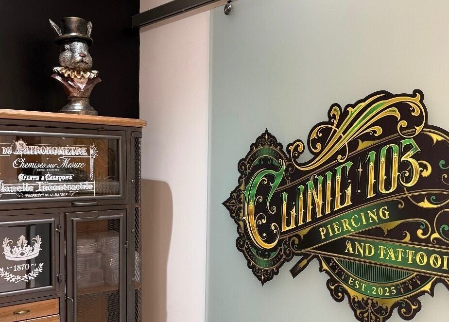 Entrance of Clinic 103 in Harpenden, England, showcasing a vintage decor and detailed sign.