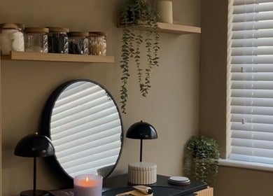 Elegant beauty corner at SH Beauty, Andover, England, GB showcasing a mirror and candle.