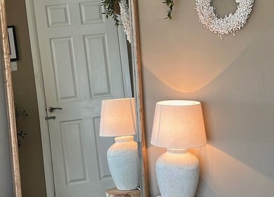 Elegant corner with mirror and lamp in SH Beauty, Andover, England, GB creating a warm, inviting ambiance.
