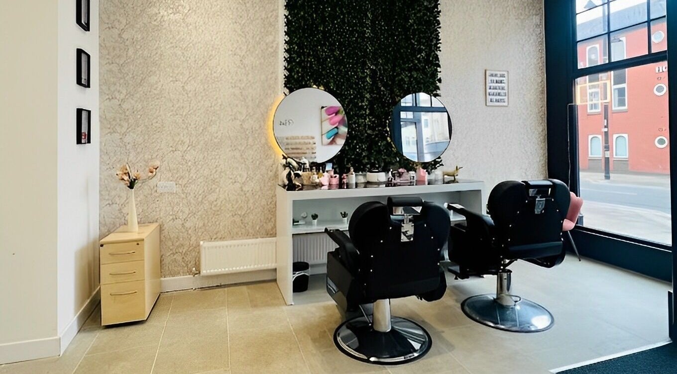 Elegant interior of Saffrons Beauty & Nails in Sunderland, England, featuring stylish salon chairs and mirrors.