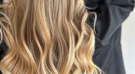 Stylish wavy blonde hair at IsabelleRose.Hair in Ipswich, England, GB. Perfect for a fresh look.