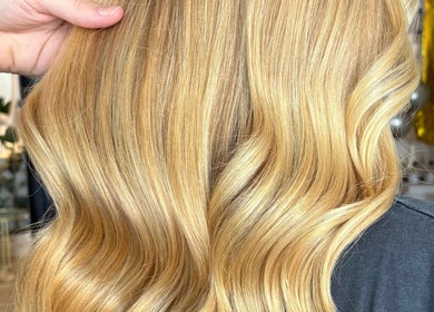 Blonde hair with soft curls at IsabelleRose.Hair, Ipswich, England, GB, showcasing salon expertise.