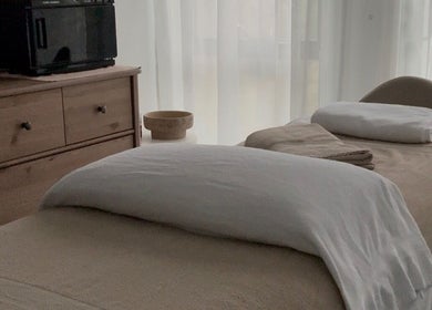Relaxing massage room at Body Therapy Studio, Melbourne, Victoria, AU with a cozy treatment table and soft lighting.