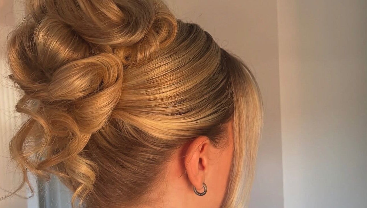 Elegant updo hairstyle at Revamp Studios, Ashington, England, GB, showcasing expert styling.