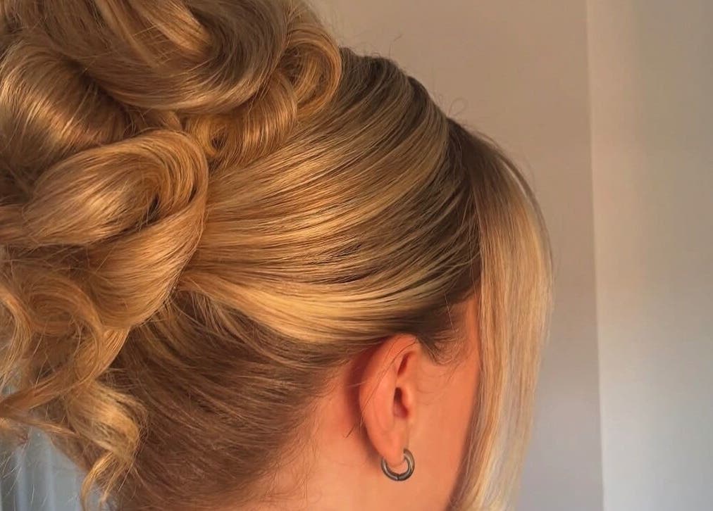 Elegant updo hairstyle at Revamp Studios, Ashington, England, GB, showcasing expert styling.