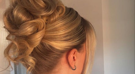 Elegant updo hairstyle at Revamp Studios, Ashington, England, GB, showcasing expert styling.