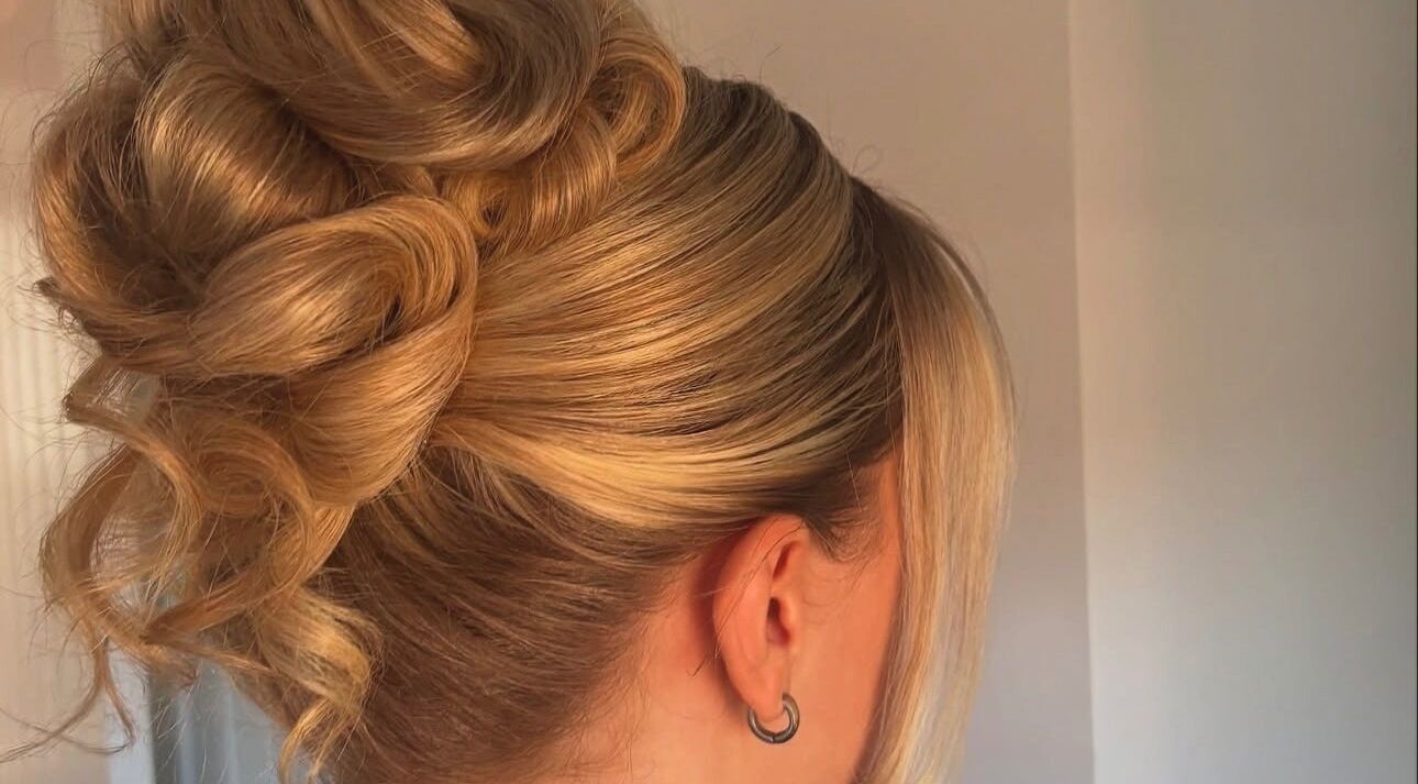 Elegant updo hairstyle at Revamp Studios, Ashington, England, GB, showcasing expert styling.