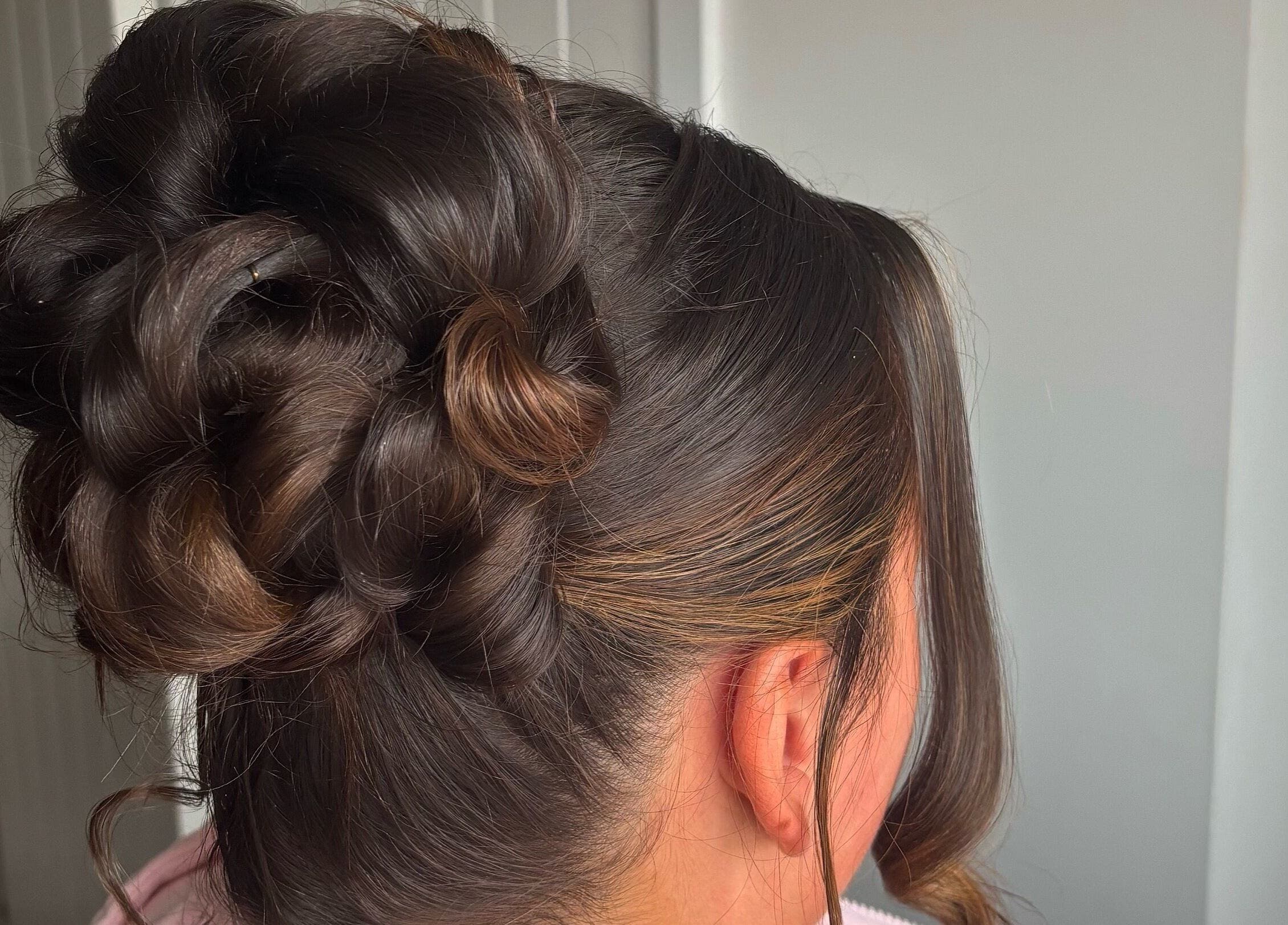 Sophisticated updo hairstyle at Revamp Studios, Ashington, England, GB.