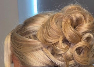 Elegant blonde updo hairstyle crafted at Revamp Studios, Ashington, England, GB.