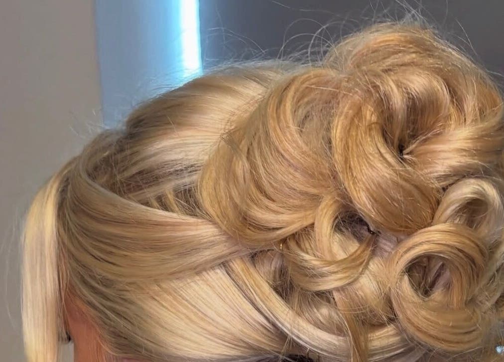Elegant blonde updo hairstyle crafted at Revamp Studios, Ashington, England, GB.