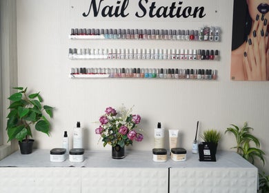 Nail polish display at Maid Hassan Beauty Center, Tarut, Eastern Province, SA, with elegant decor.