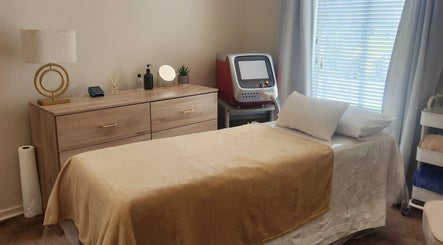 Tranquil treatment room at barewithtea_laser_studio, Randburg, Gauteng, ZA, featuring a cozy bed and laser equipment.