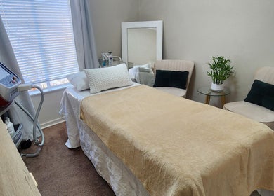 Calm treatment room at barewithtea_laser_studio, Randburg, Gauteng, ZA showcasing a comfortable bed and decor.