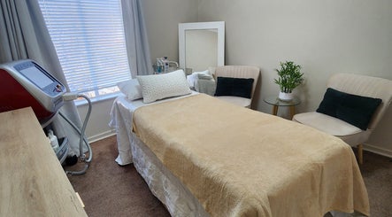 Calm treatment room at barewithtea_laser_studio, Randburg, Gauteng, ZA showcasing a comfortable bed and decor.