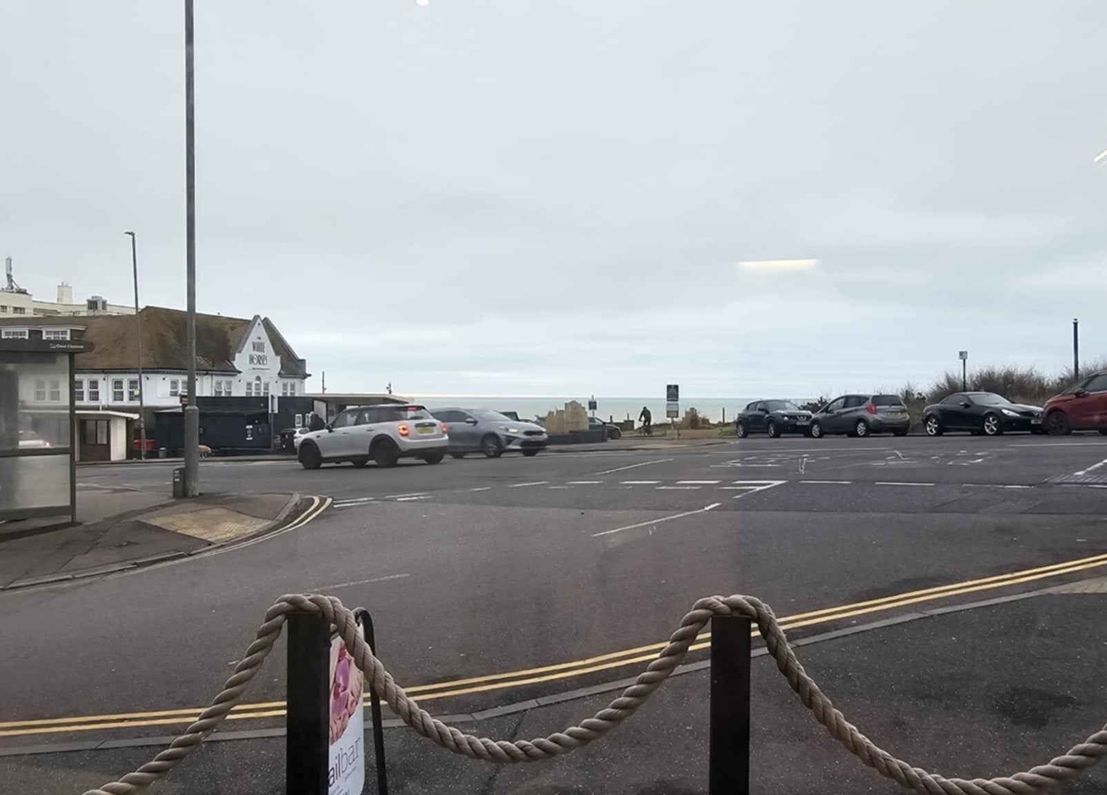 Street view from Gg Nails Rottingdean in Brighton And Hove, England, GB overlooking the sea.