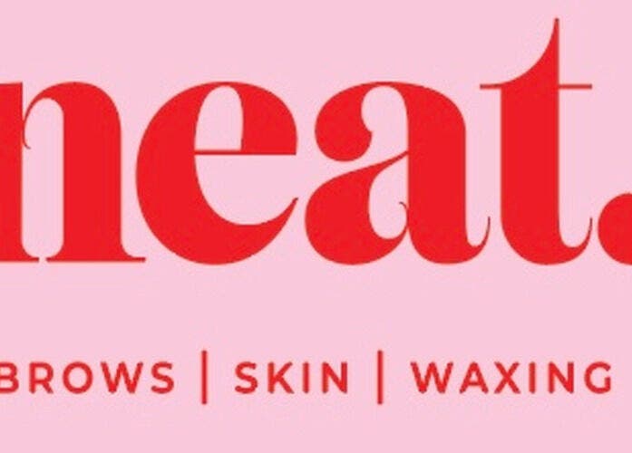 NEAT salon logo in bold red on pink background, Dublin, IE.