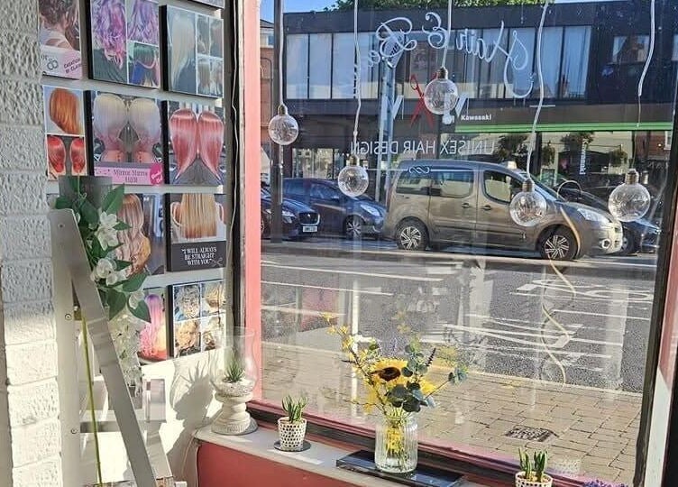 Inside Mirror Mirror, Worcester, England, showcasing stylish wall displays and street view.