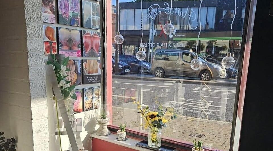 Inside Mirror Mirror, Worcester, England, showcasing stylish wall displays and street view.