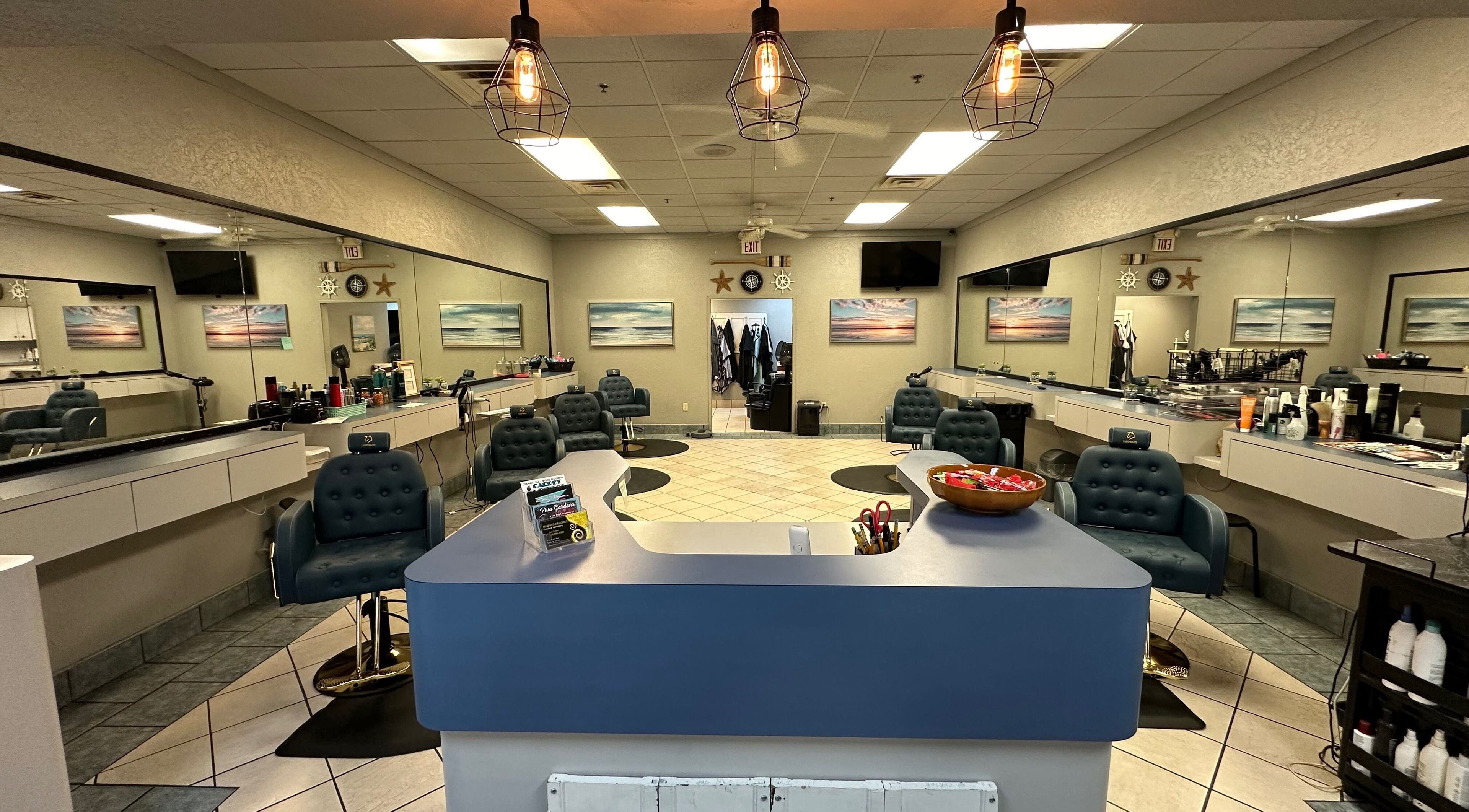 Interior of The Wave Salon, Broken Arrow, Oklahoma, US showcasing stylish styling stations and elegant decor.