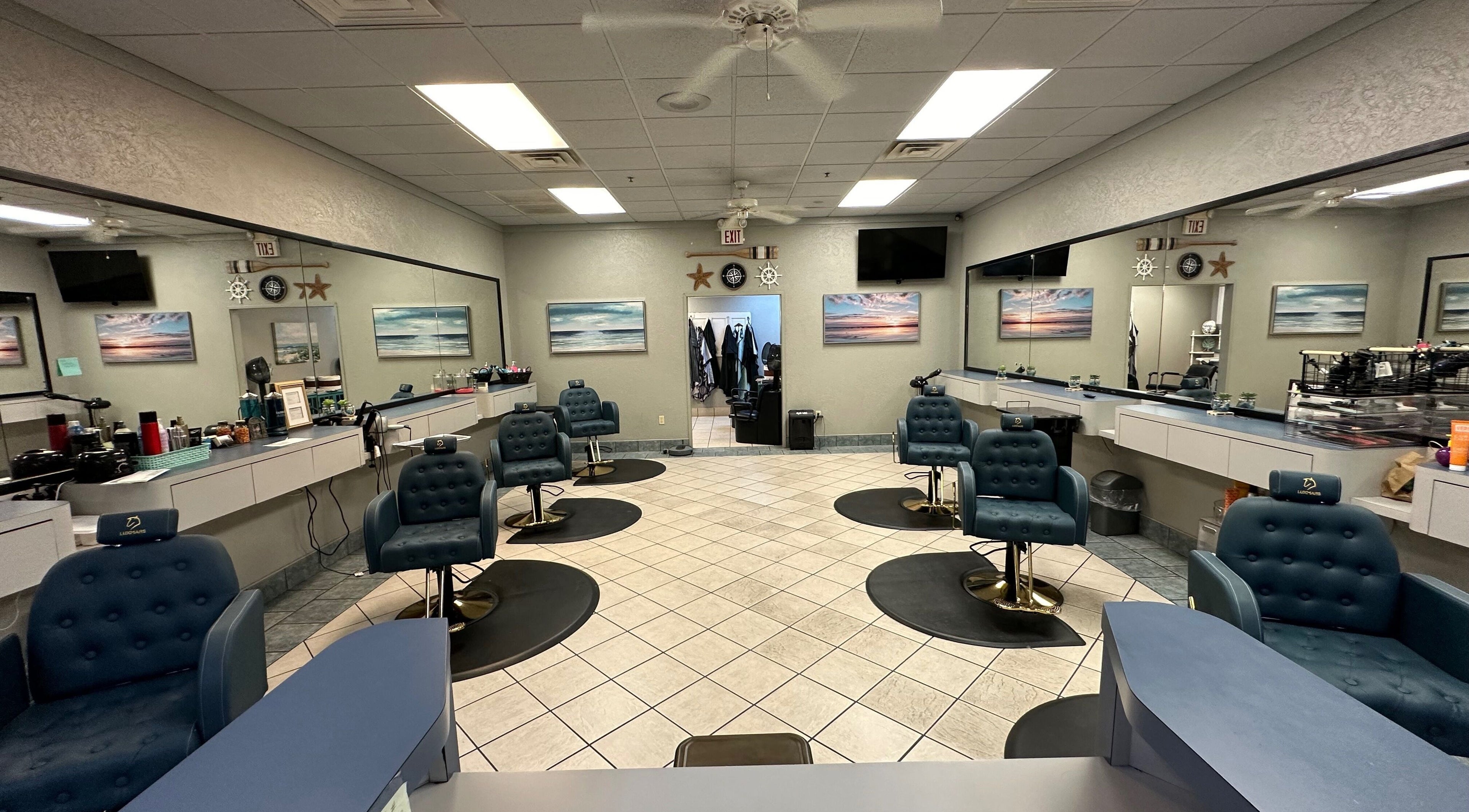 Spacious interior of The Wave Salon in Broken Arrow, Oklahoma, US with stylist stations and artwork.