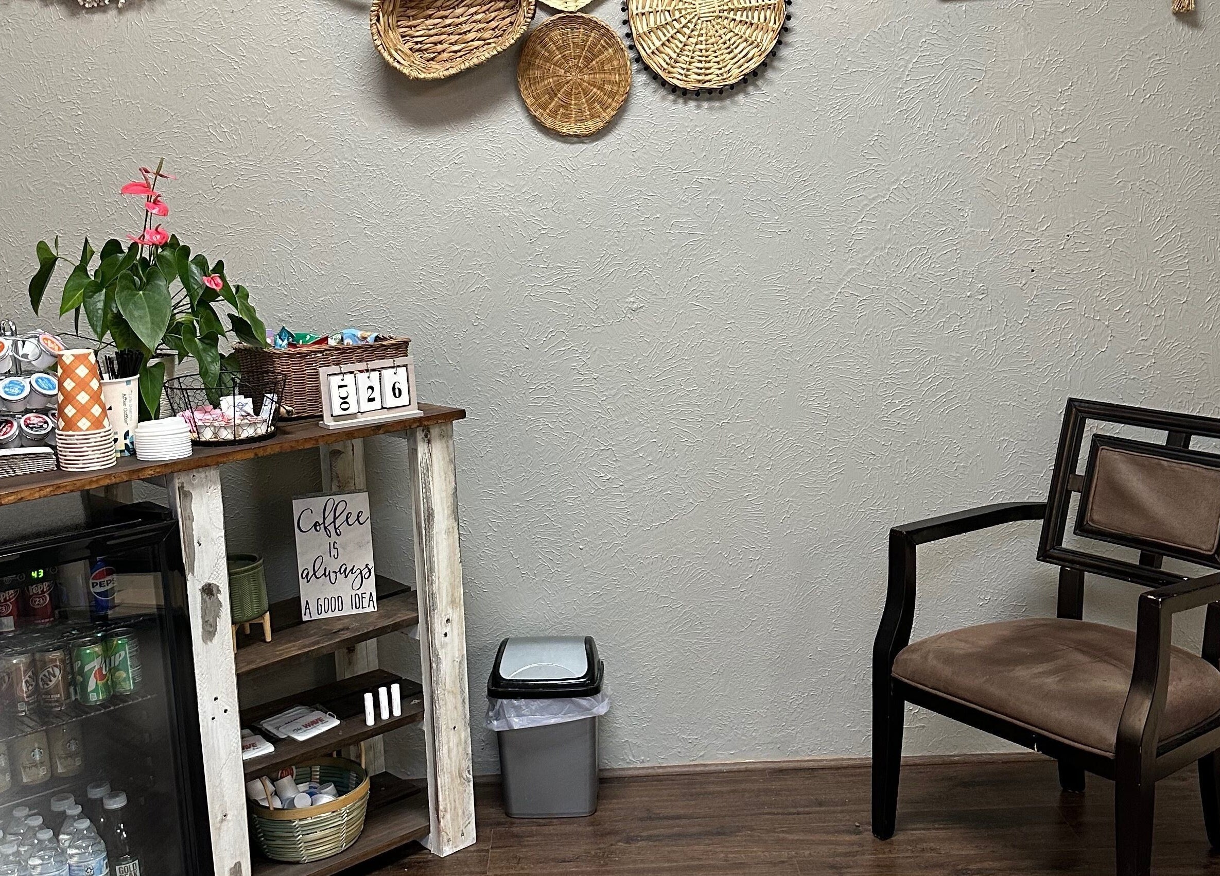 Relaxing corner with chair and refreshments at The Wave Salon, Broken Arrow, Oklahoma, US.